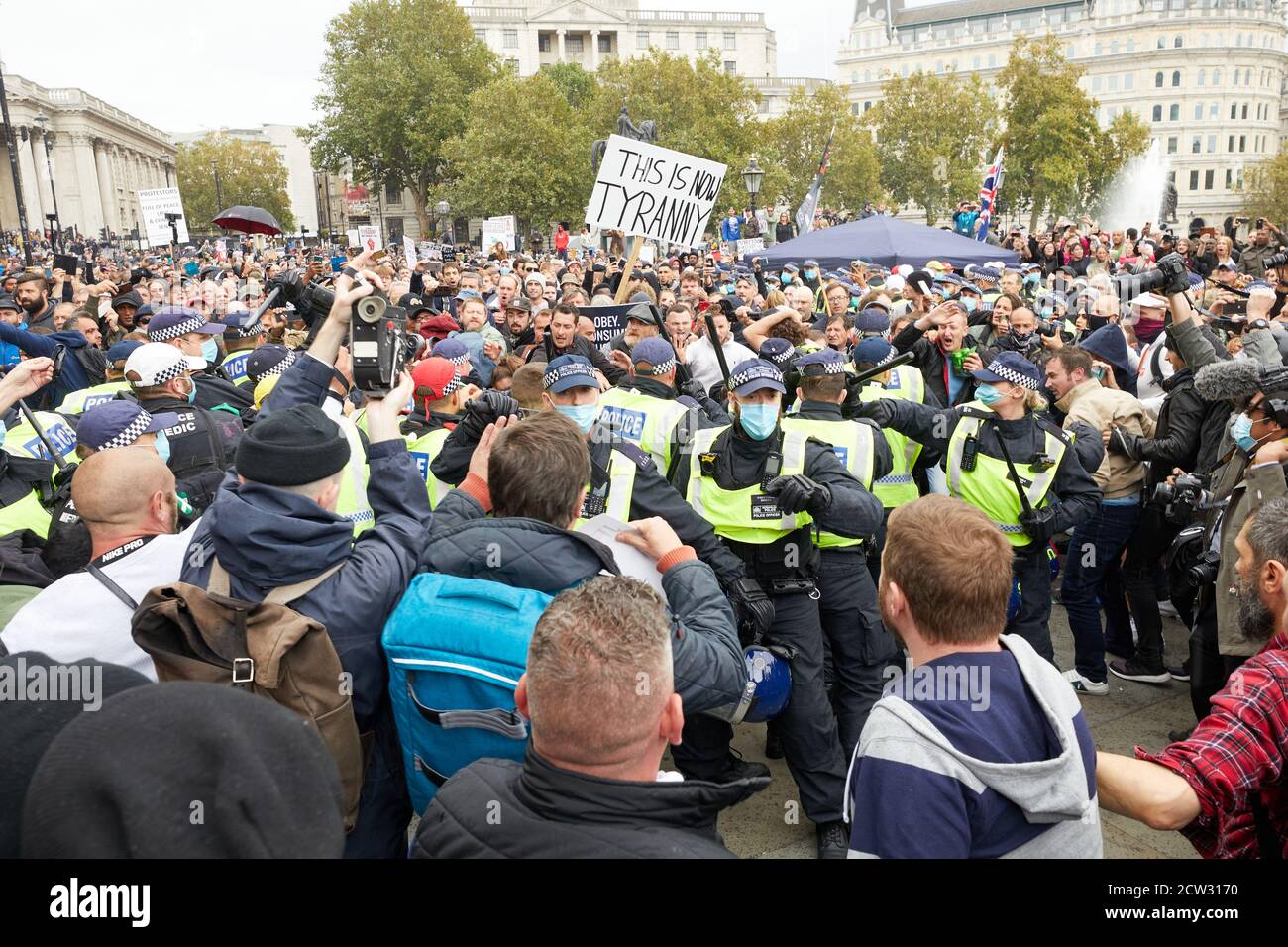London, UK. - 26 Sept 2020: Police clash with demonstrators at a protest in Trafalgar Square against coronavirus restrictions. Stock Photo