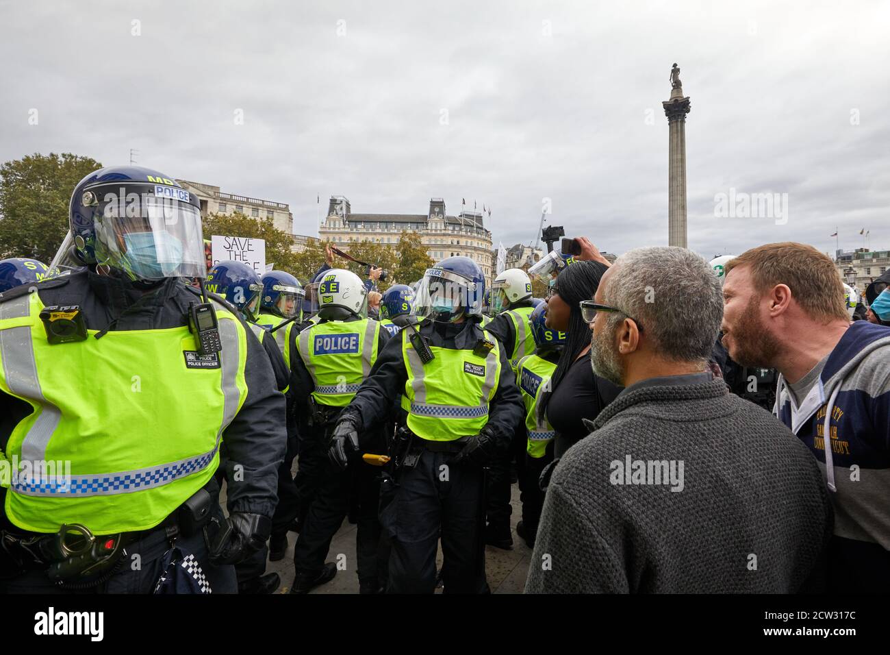 London, UK. - 26 Sept 2020: Protestors remonstrate with police at a protest in Trafalgar Square against coronavirus restrictions. Stock Photo