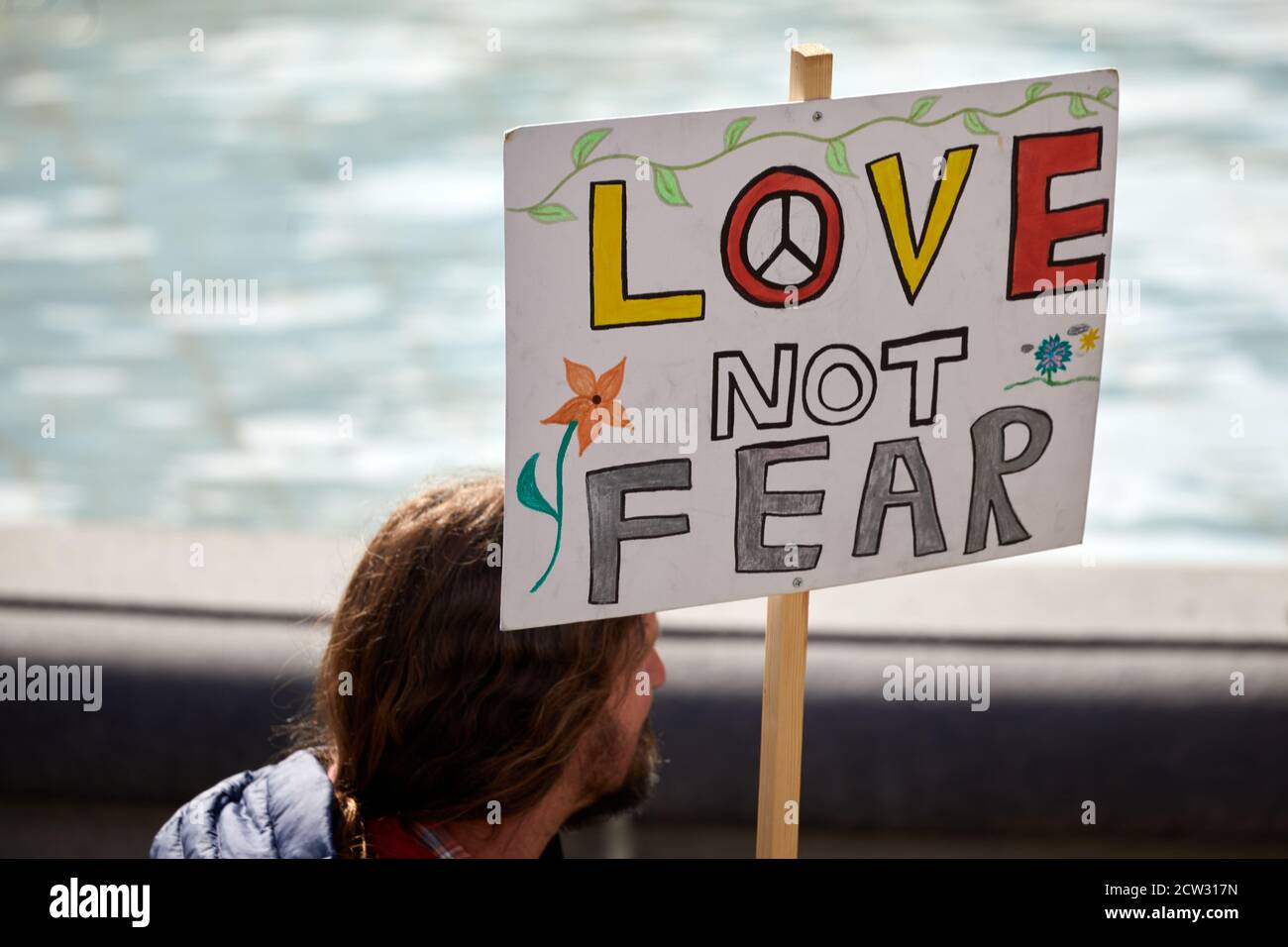 London, UK. - 26 Sept 2020: A placard, critical of government regulations during the coronavirus pandemic, is held aloft at a protest in Trafalgar Square. Stock Photo