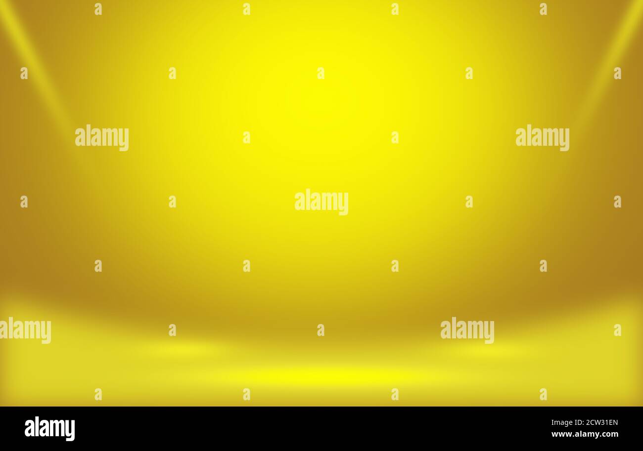 Abstract yellow Studio room background with rays spotlight and empty space. Stock Photo