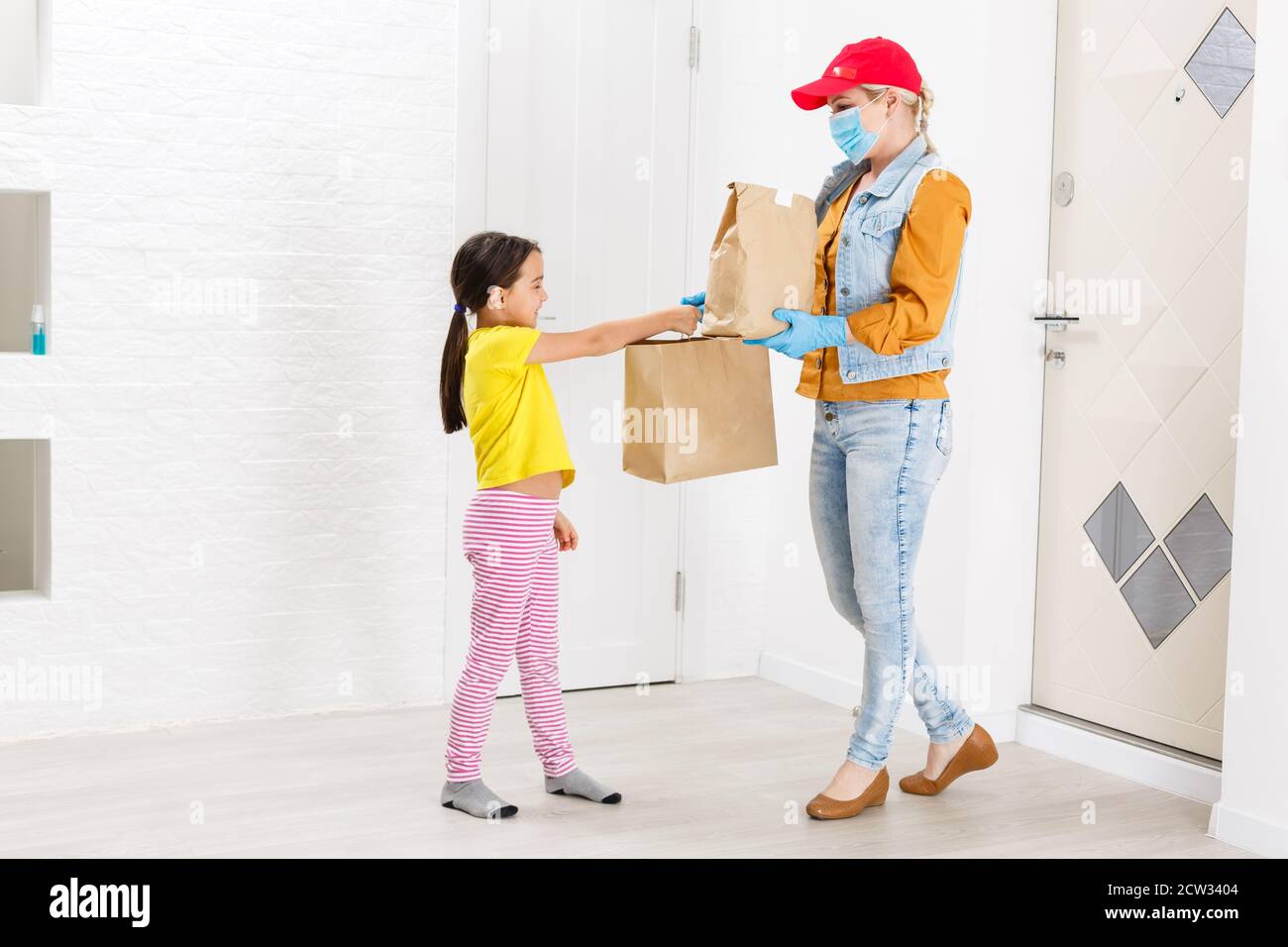 Happy Little Girl receiving in Delivered Pacakge, delivery for children Stock Photo Alamy