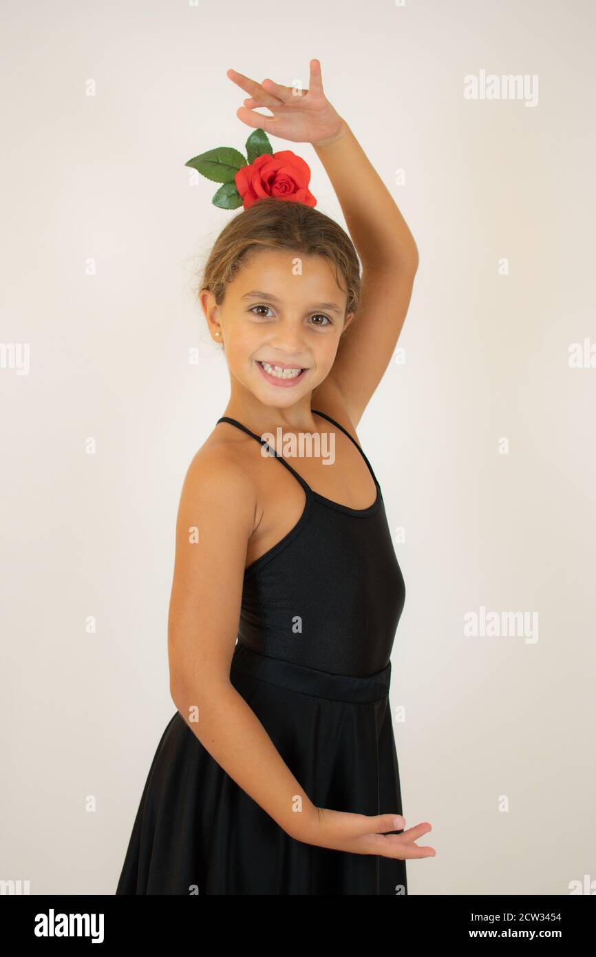 Little girl dancing flamenco in traditional flamenco dress Stock Photo