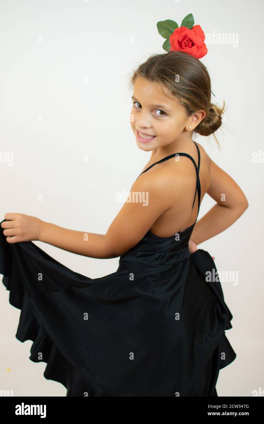 Little girl dancing flamenco in traditional flamenco dress Stock Photo