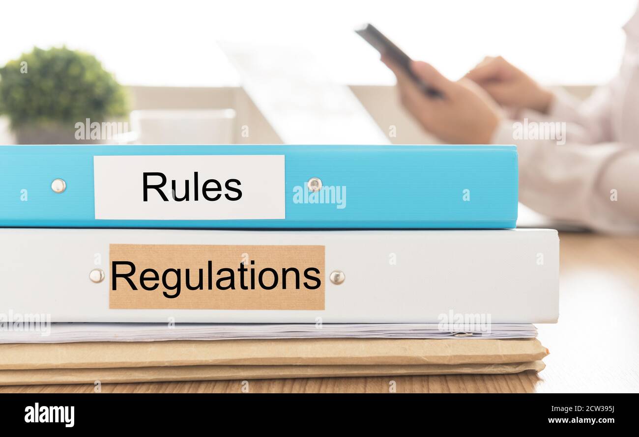 rules and regulations document on desk in meeting room. concept of rules and regulations operational. Stock Photo