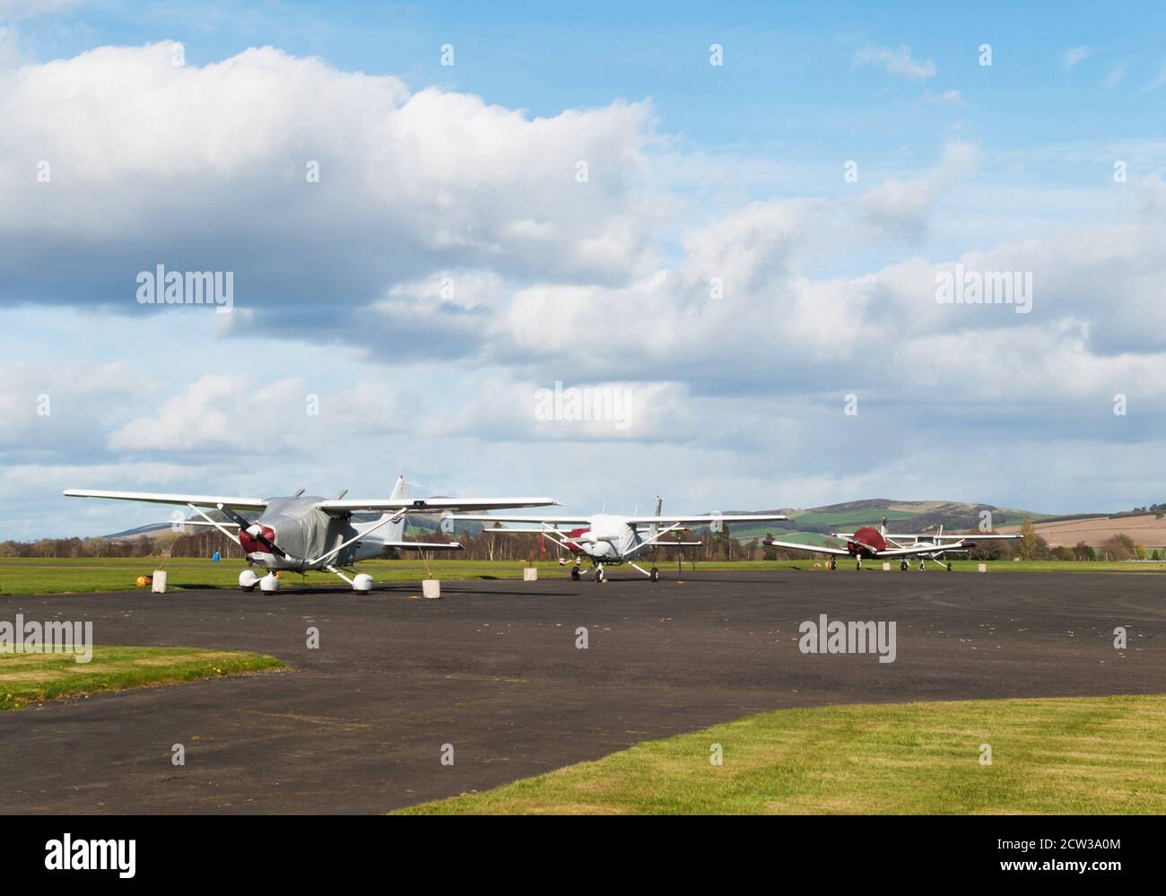 Small sport airplanes parked on runway Stock Photo - Alamy