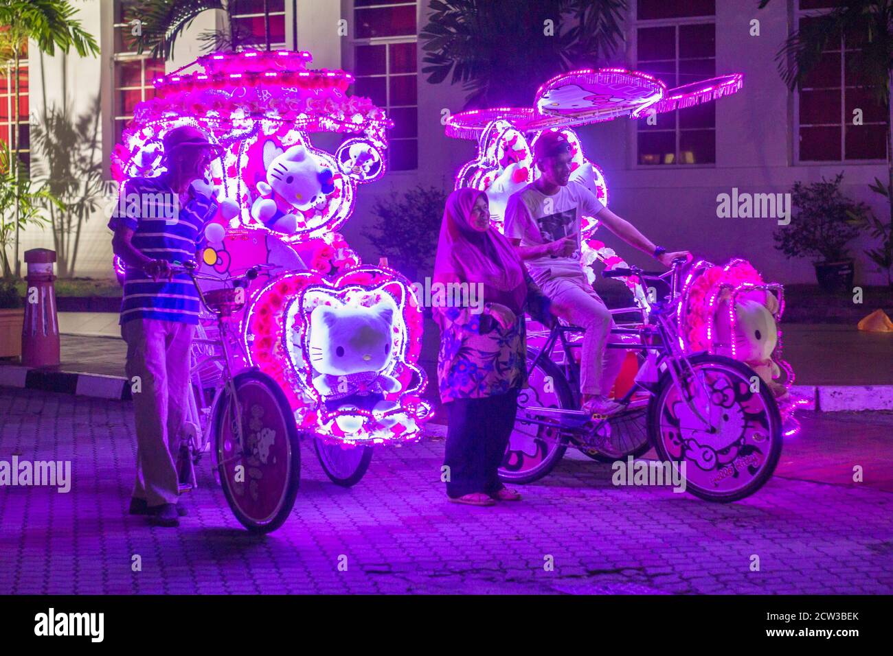 Decorated tricycles in Melaka are aglow at night Stock Photo Alamy