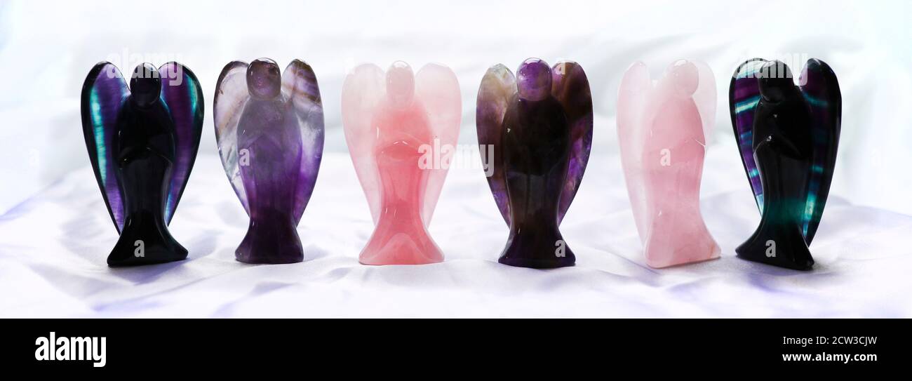 Crystal Angels made from Rose quartz, Amethyst and Fluorite Stock Photo