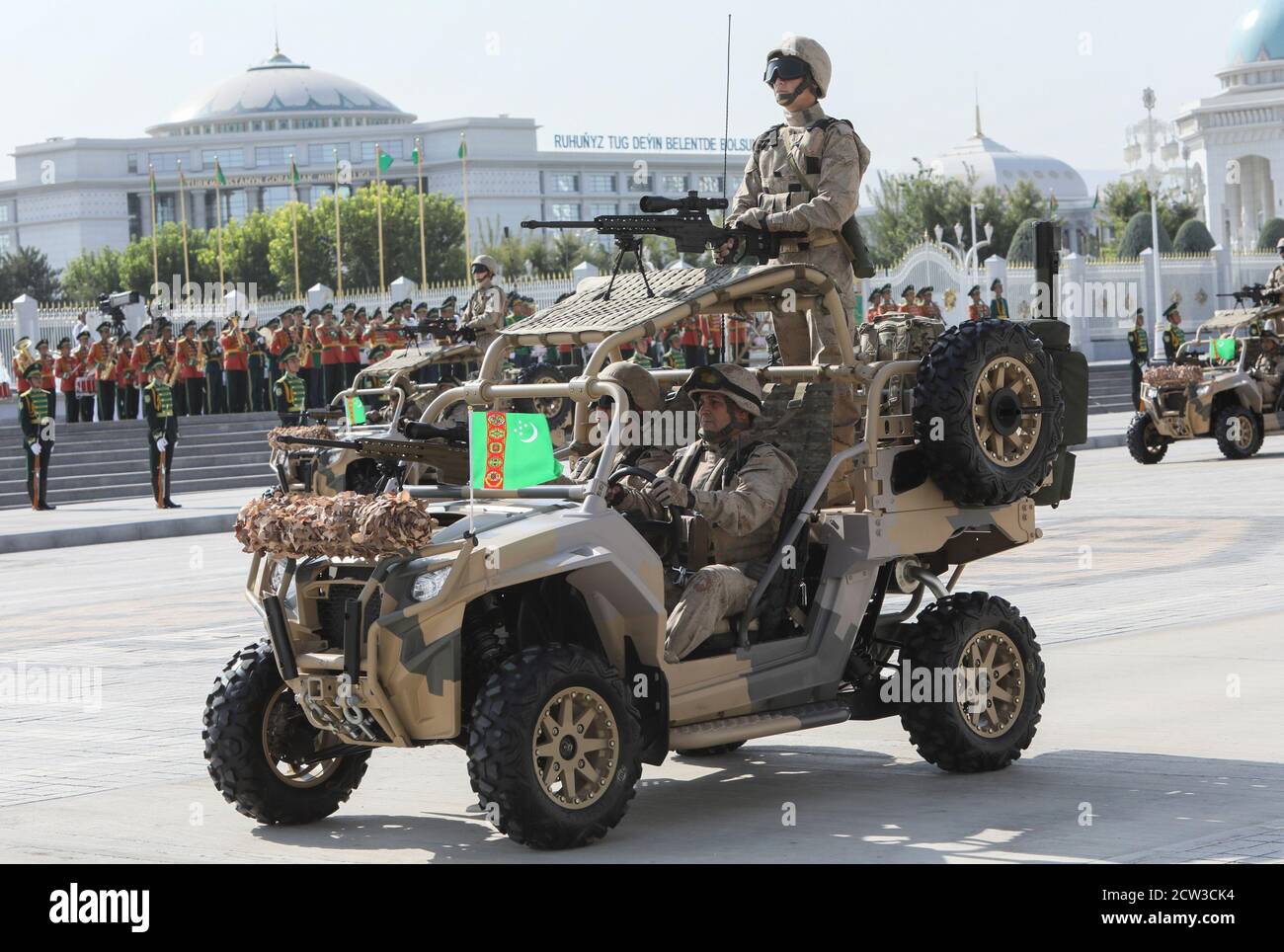 Turkmen service members drive vehicles during a parade marking Independence Day in Ashgabat, Turkmenistan September 27, 2020. REUTERS/Vyacheslav Sarkisyan Stock Photo