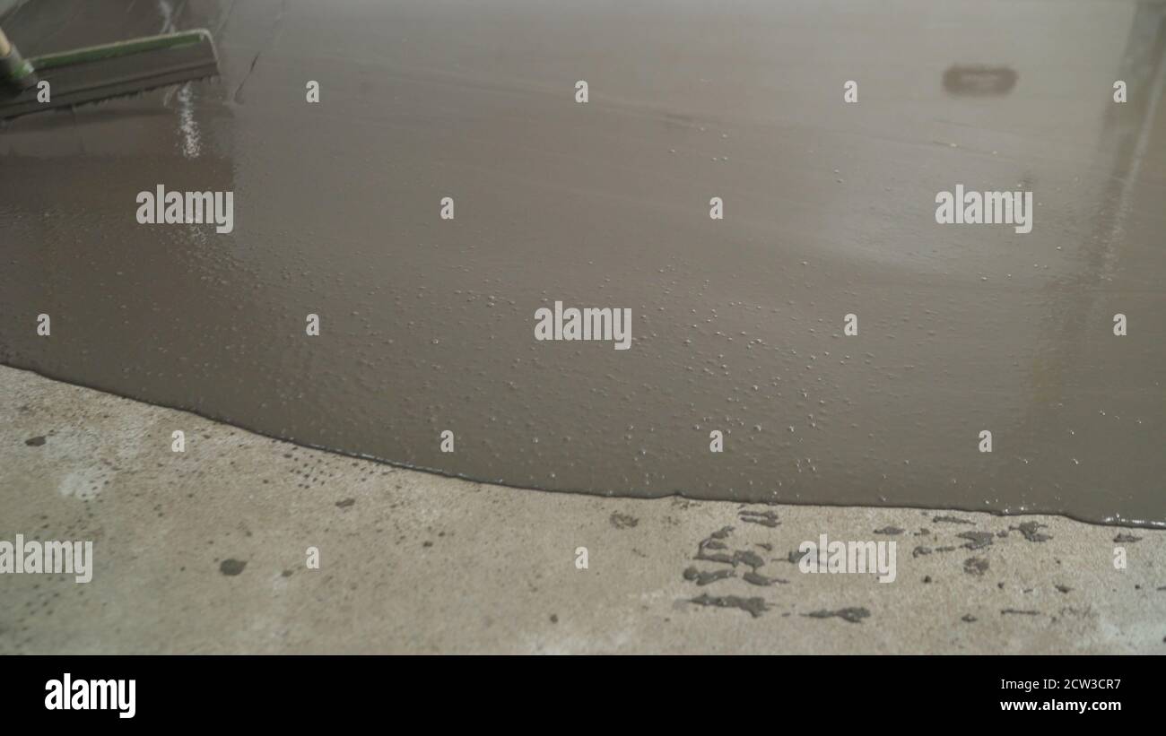 Pour the liquid floor onto the concrete surface. Leveling the floor