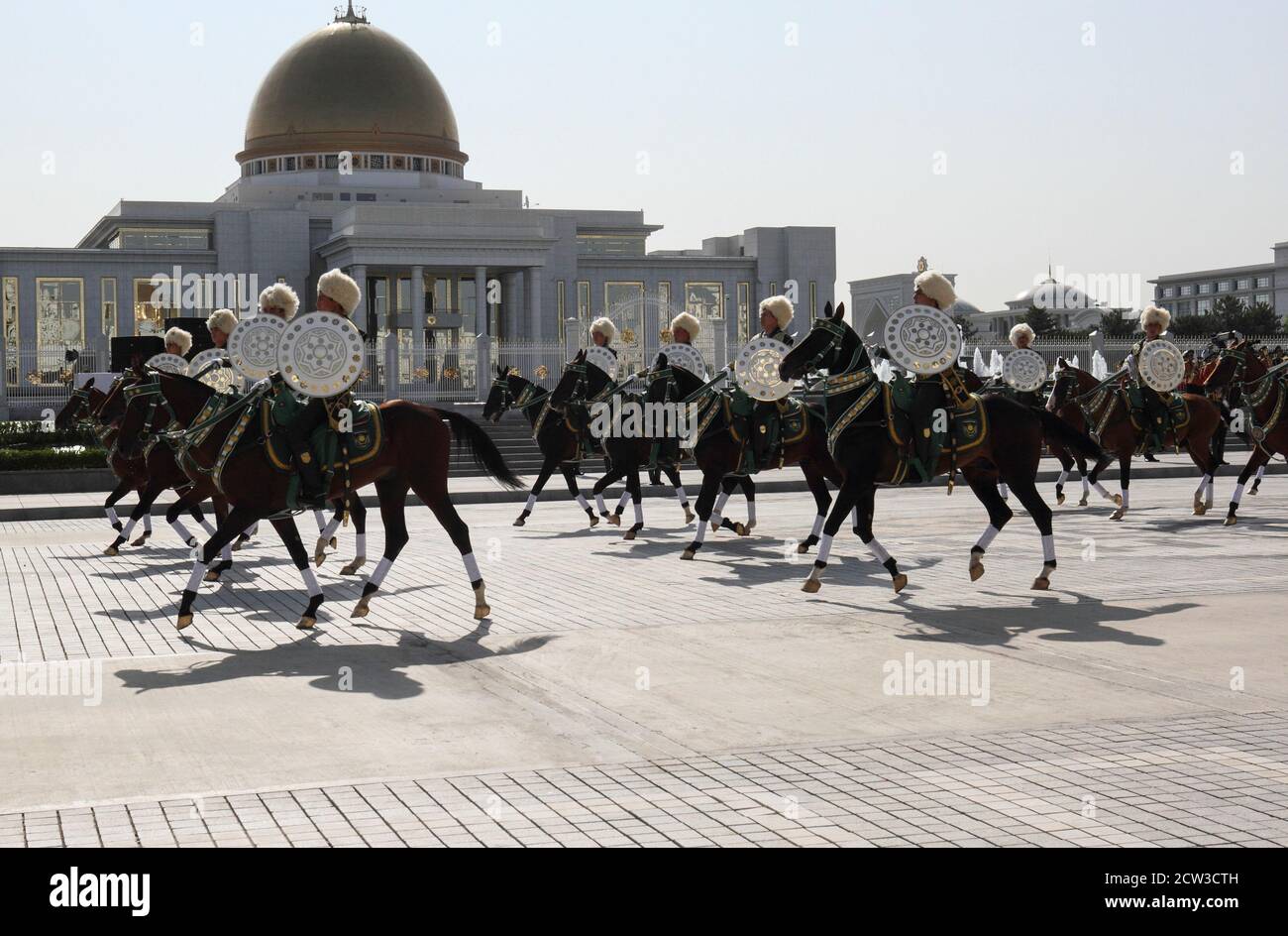 Turkmen service members ride horses during a parade marking Independence Day in Ashgabat, Turkmenistan September 27, 2020. REUTERS/Vyacheslav Sarkisyan Stock Photo