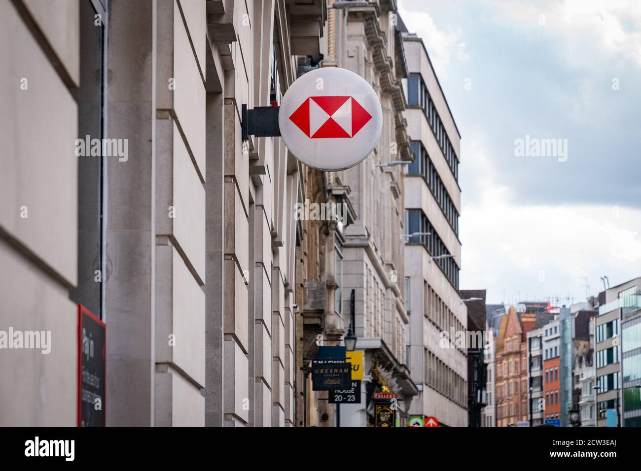 LONDON, ENGLAND - JULY 24, 2020: HSBC Bank plc signboard logo affixed to the wall of a branch on the High Street at Holborn, London  - 012 Stock Photo