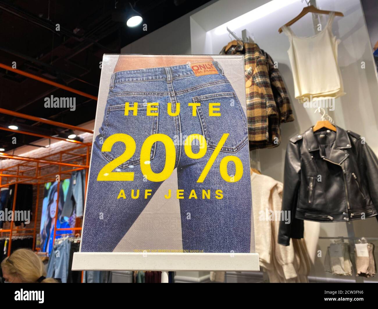 Monchengladbach, Germany - September 9. 2020: View on isolated card board  showing 20 percent discount on jeans in fashion store (focus on board Stock  Photo - Alamy