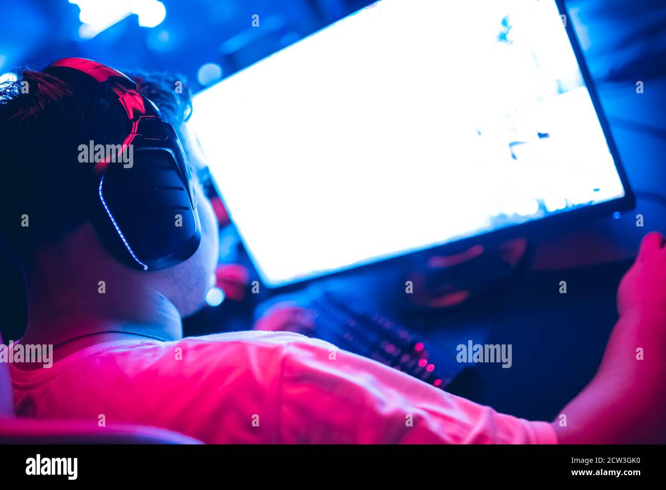 Professional gamer playing online games tournaments pc computer with