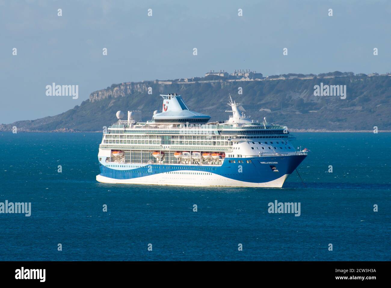 Weymouth, Dorset, UK.  27th September 2020.  The empty TUI cruise ship Marella Discovery at anchor on a sunny morning in Weymouth Bay off the coast of Weymouth in Dorset during the cruising shutdown because of Covid-19. Picture Credit: Graham Hunt/Alamy Live News Stock Photo