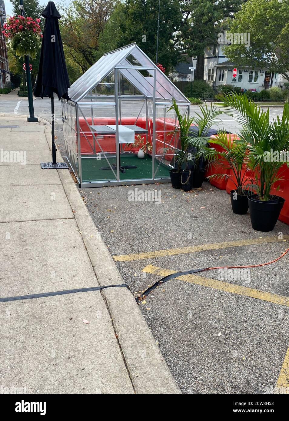 Greenhouse used creatively for outdoor dining space at 501 Local, a neighborhood bistro in Winnetka, IL Stock Photo