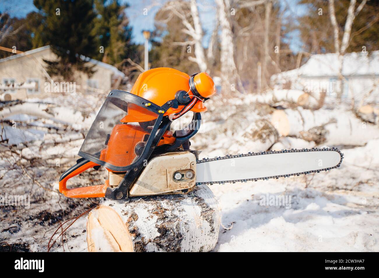 Yellow chainsaw. Concept of lumberjacks, sawing rotten and old trees
