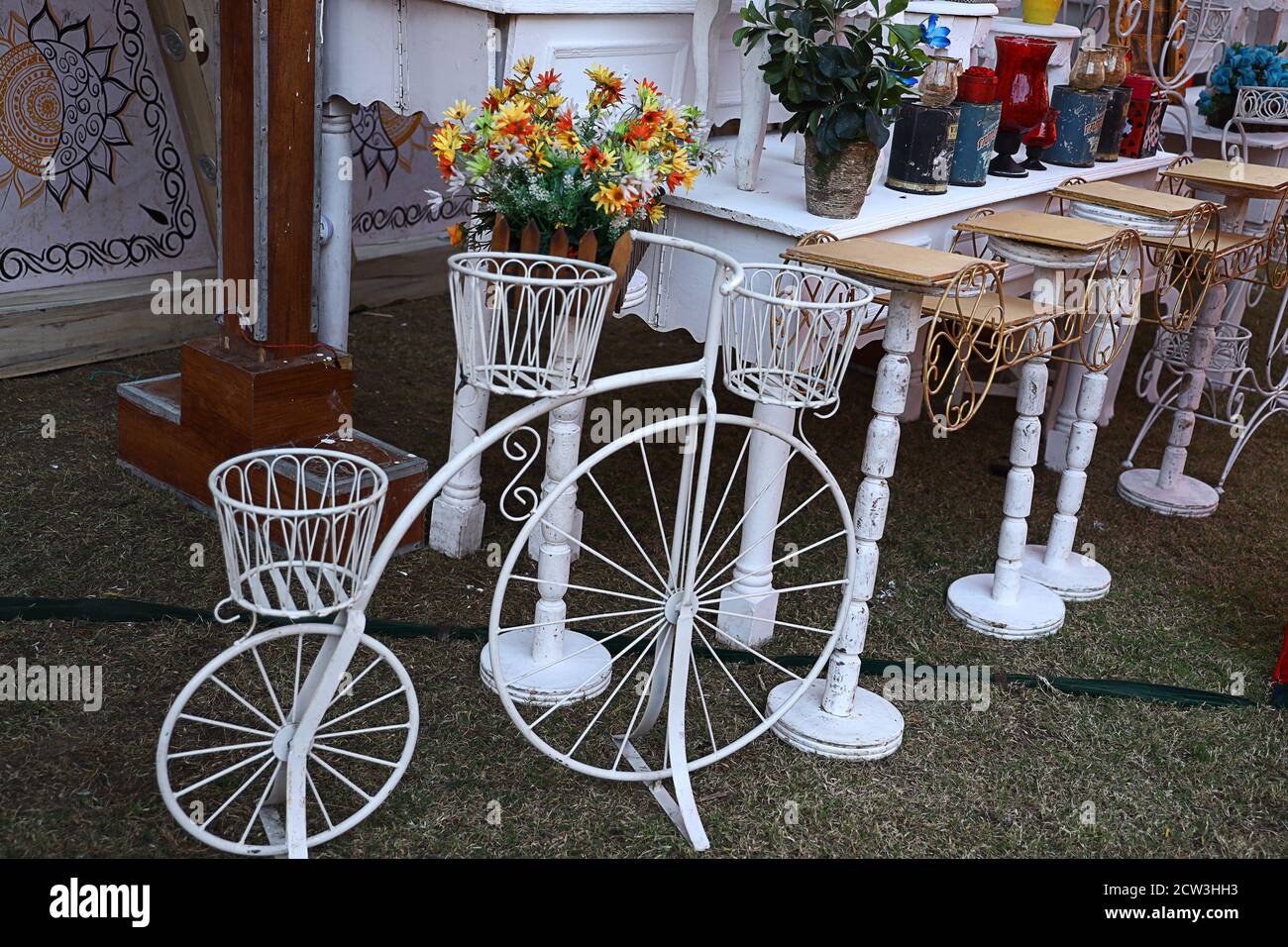 Decorative vintage old model bicycle with vases for flowers on a