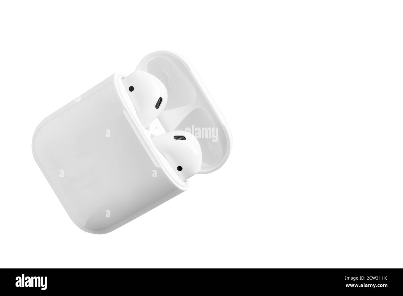 White headphones wireless earphones with case, copy space isolated background Stock Photo