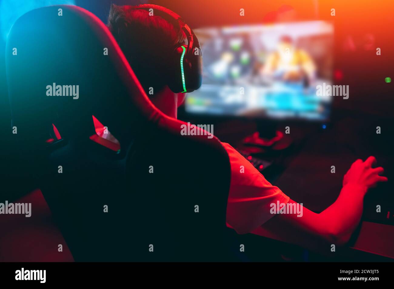 Professional gamer playing online games tournaments pc computer with