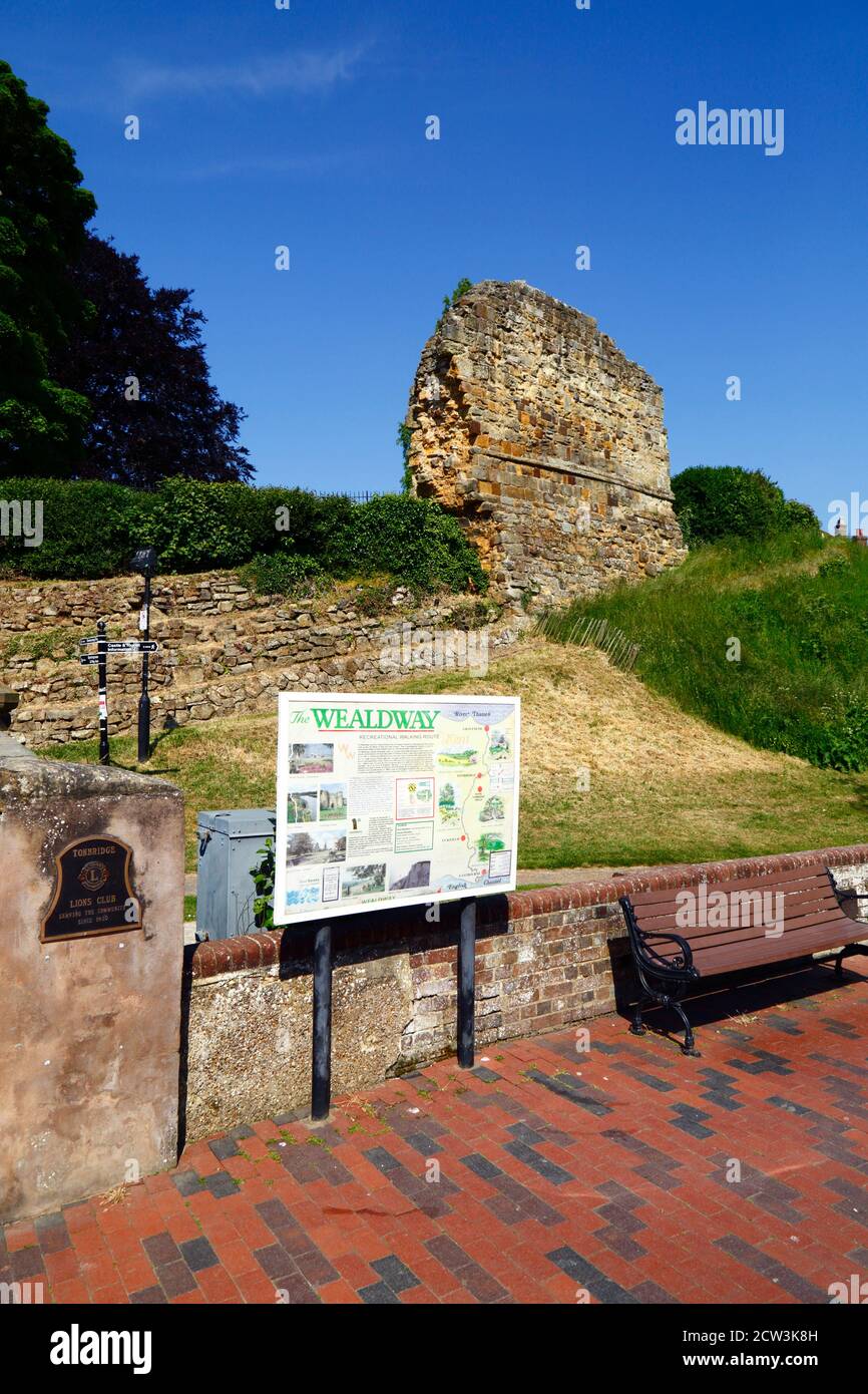 Wealdway long distance footpath information sign and part of outer walls of Tonbridge Castle, High Street, Tonbridge, Kent , England Stock Photo