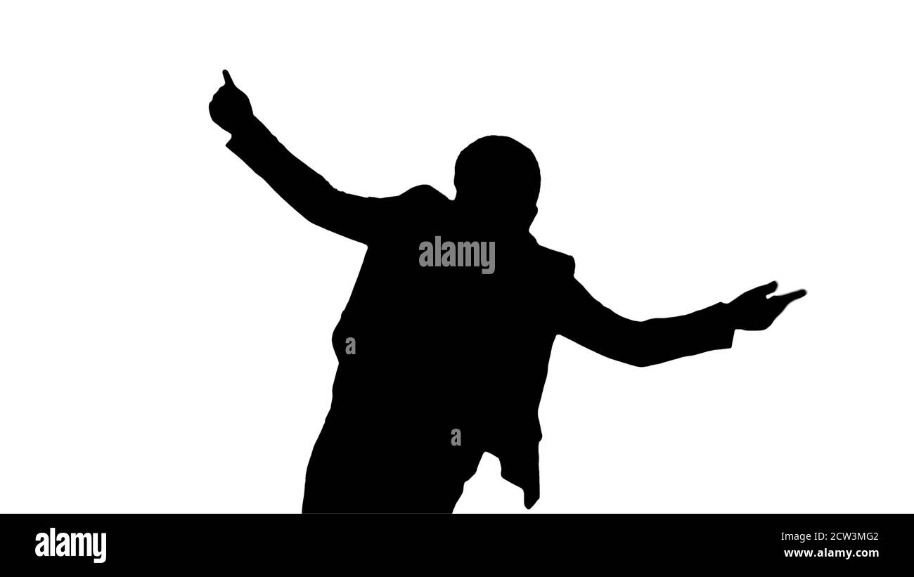 Silhouette Boy in white suit dancing. Stock Photo