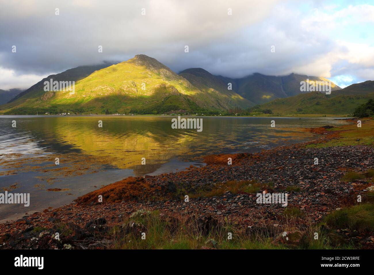 Landscape image of the Five Sisters of Kintail Mountain range from the shores of Loch Duich, Glen Shiel, West Highlands, Scotland, UK. Stock Photo