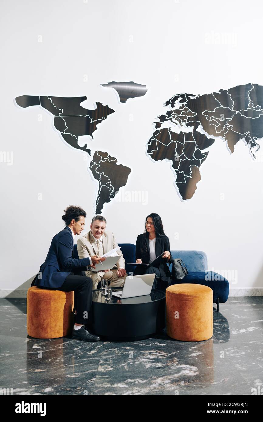 Business people discussing documents Stock Photo