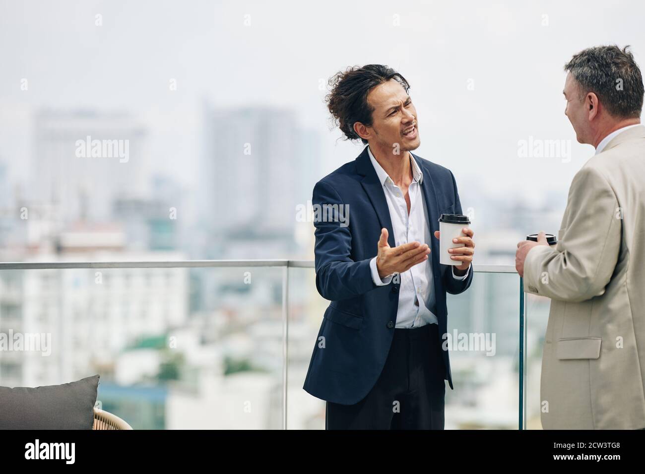 Businessman trying to prove his point Stock Photo