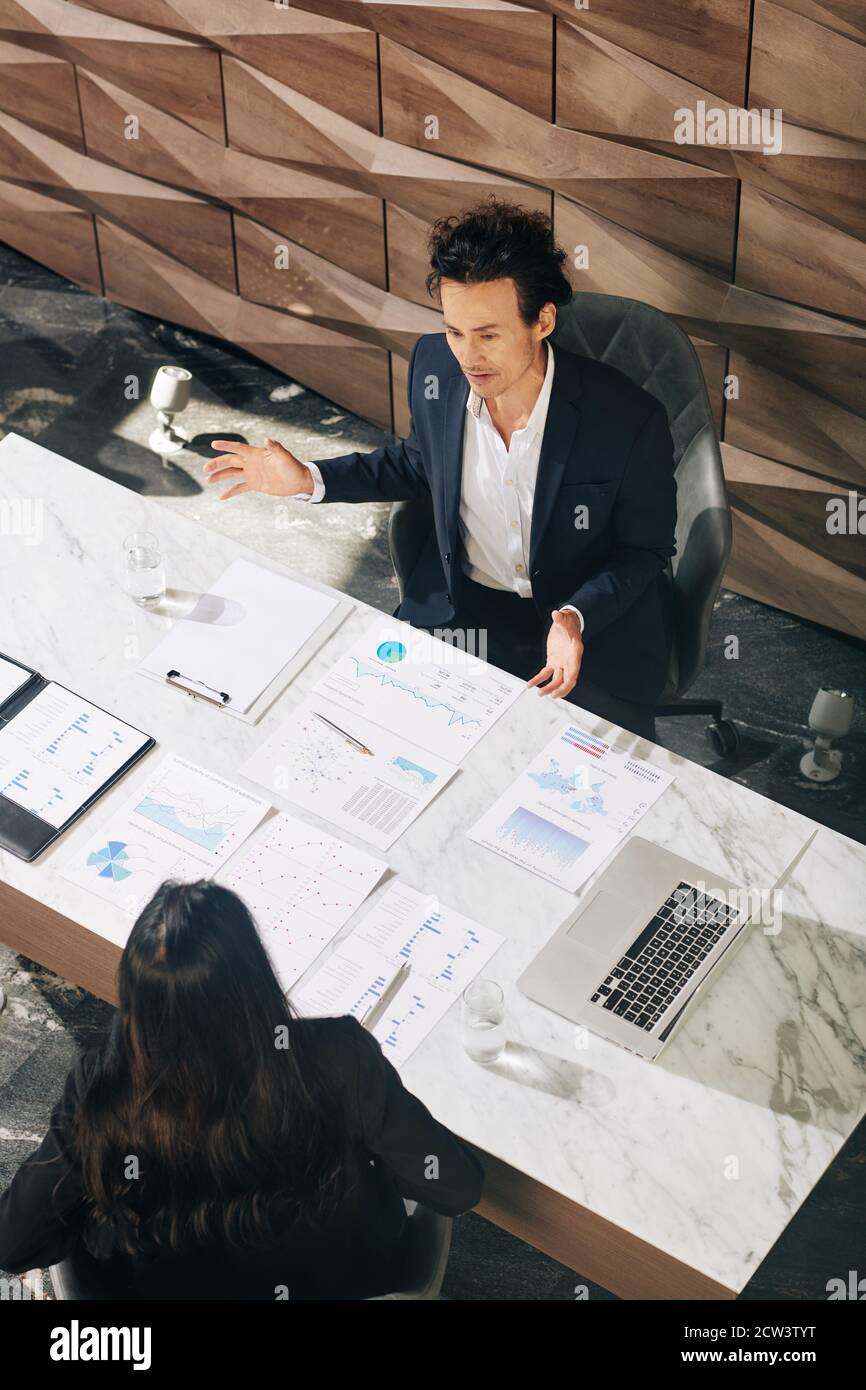 Business people discussing reports Stock Photo