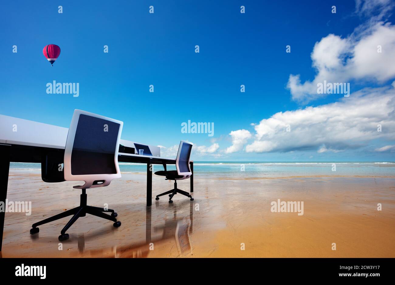 Office table with chairs on the beach concept of remote work over hot