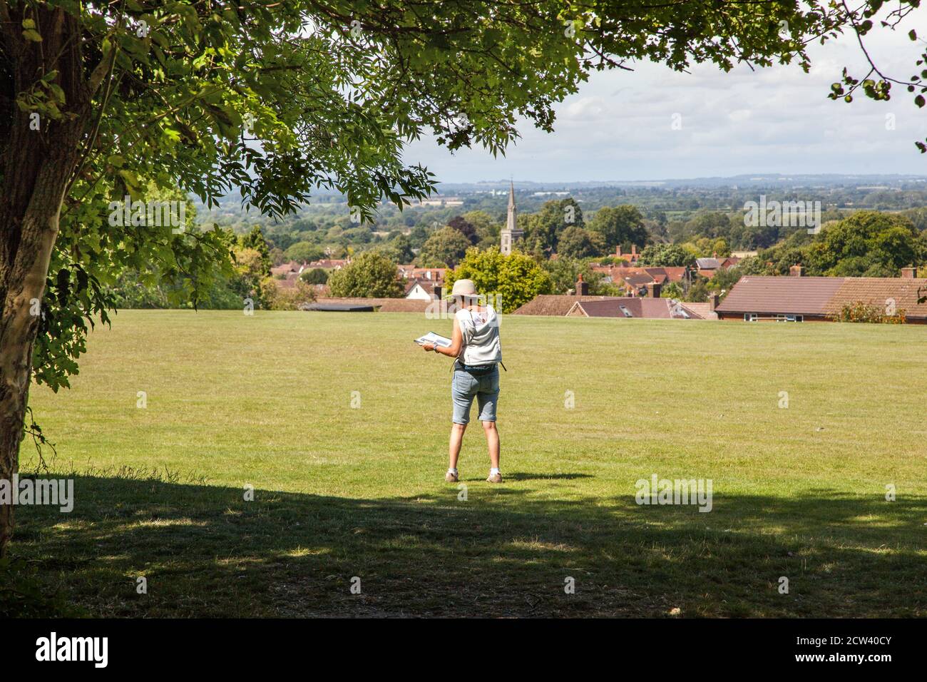 Woman  walking on  the Ridgeway long distance footpath  trail in the Chiltern hills  Buckinghamshire England Stock Photo