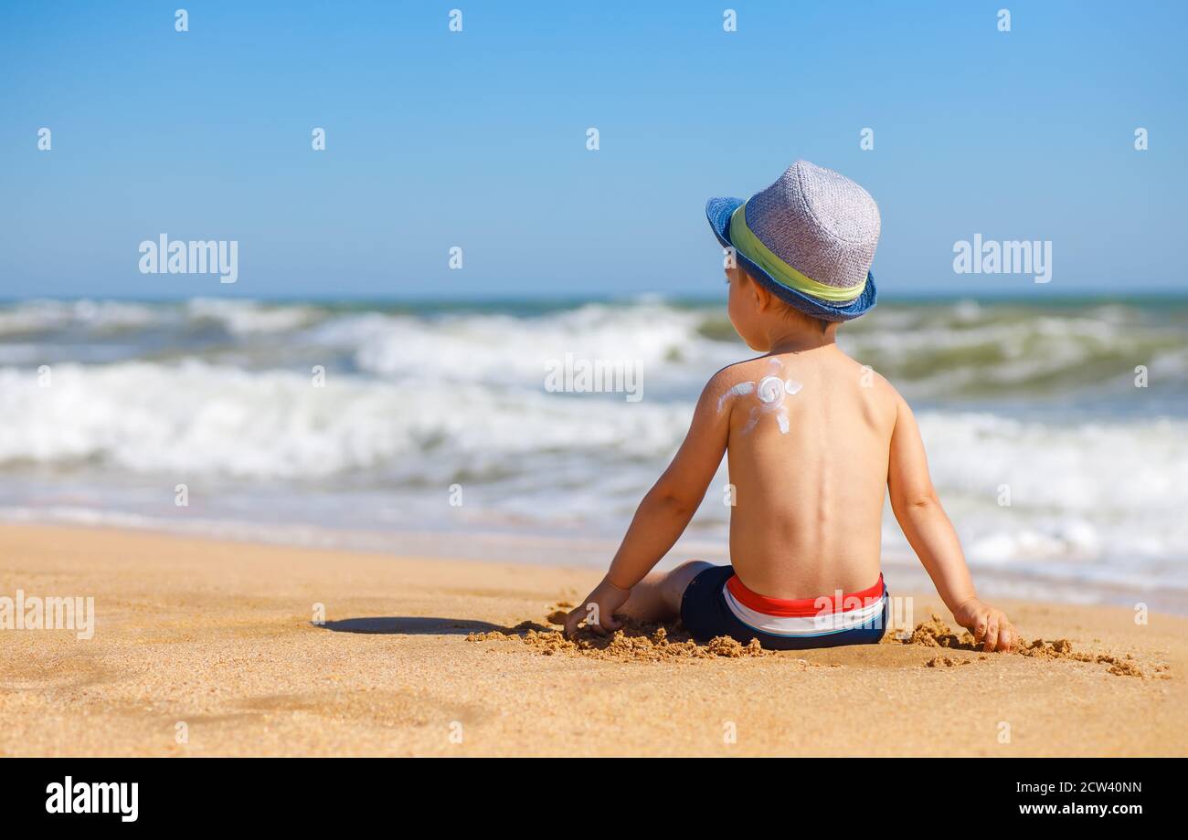 little boy with sunscreen cream on the shoulder Stock Photo Alamy