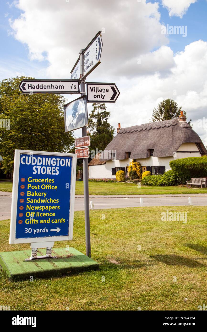 Thatched cottages on the village green in the Buckinghamshire village