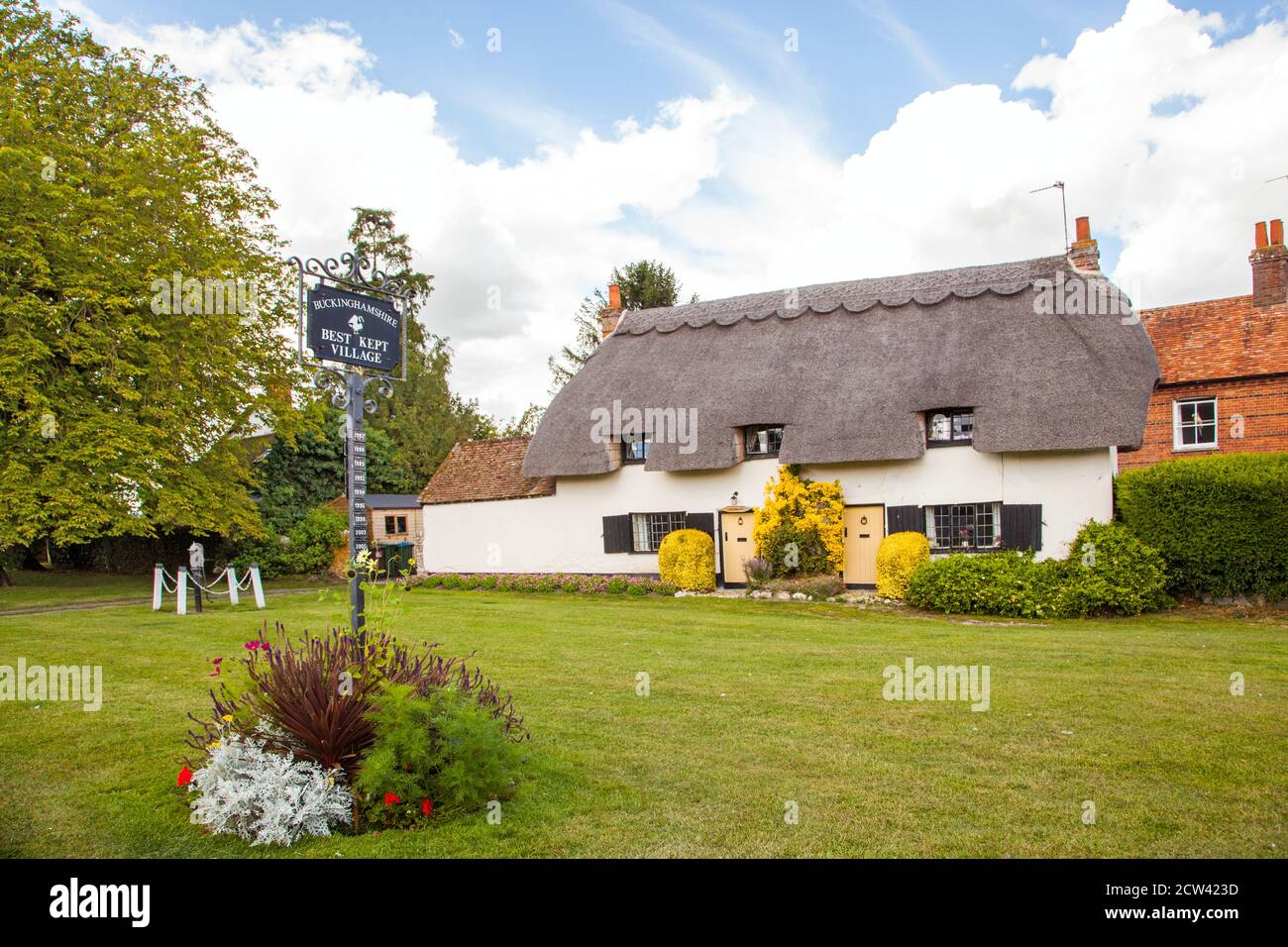 Thatched cottages on the village green in the Buckinghamshire village