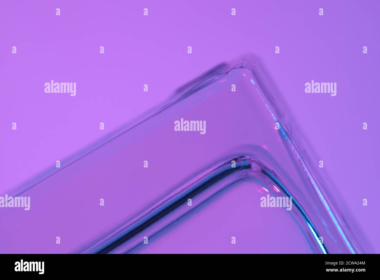 The macro picture of glass in vivid color light. Stock Photo