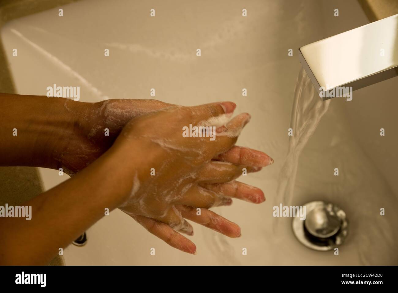 Hand washing, also known as hand hygiene, is the act of cleaning one's hands with soap and water