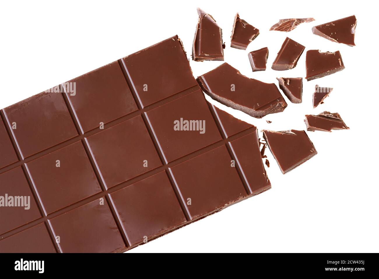 Bar of chocolate with broken cubes isolated on white background top view. Stock Photo