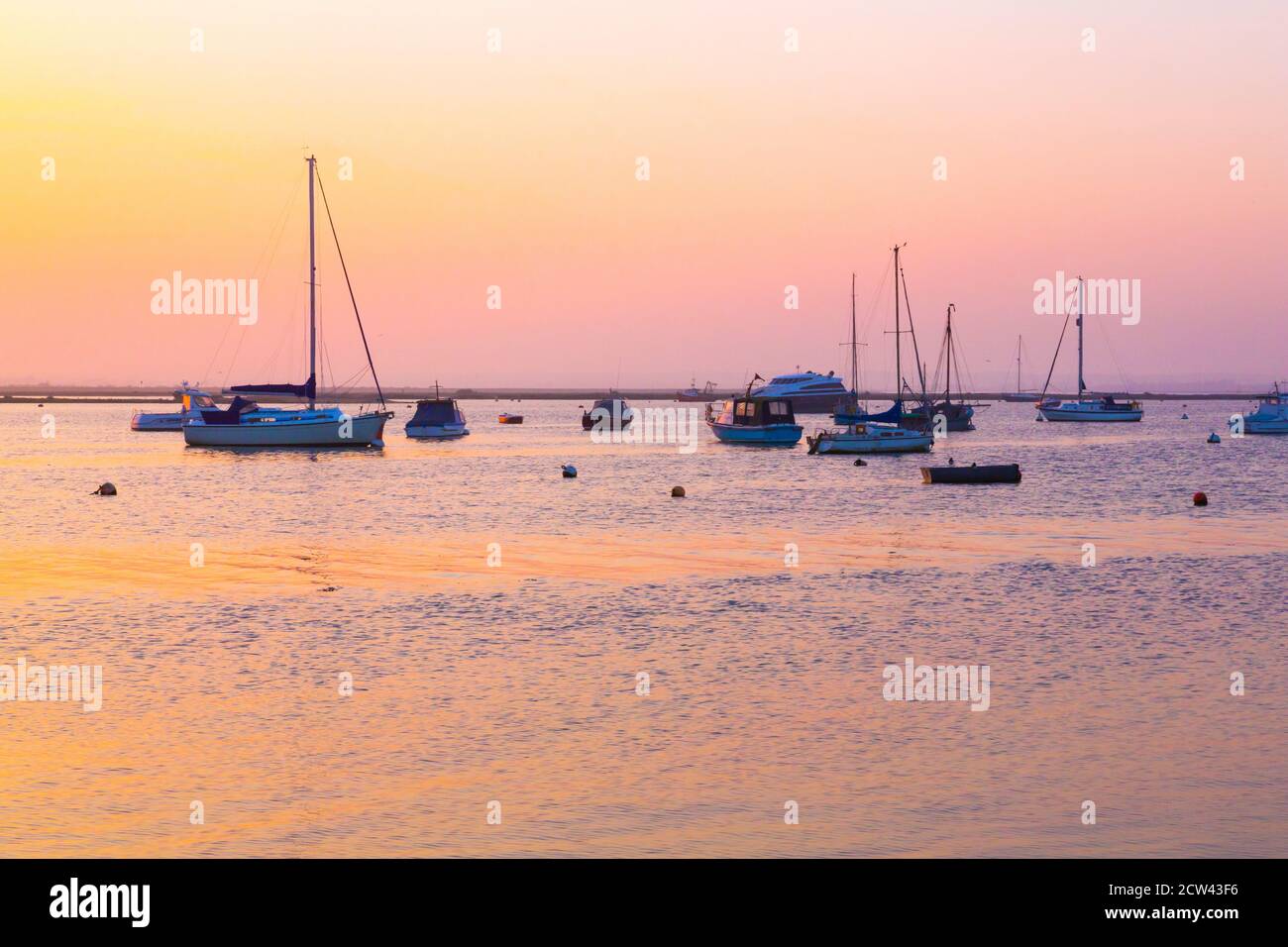 Boats on the coast of West Mersea, Essex, UK Stock Photo Alamy