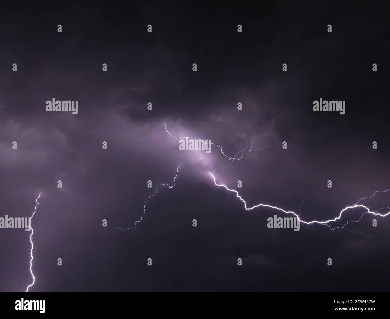 Close up of lightning bolts coming out of a cloud Stock Photo