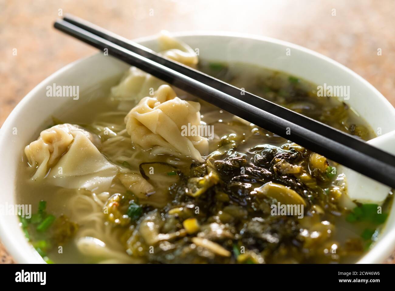 side view Chinese traditional food of wontons with pickled cabbage Stock Photo