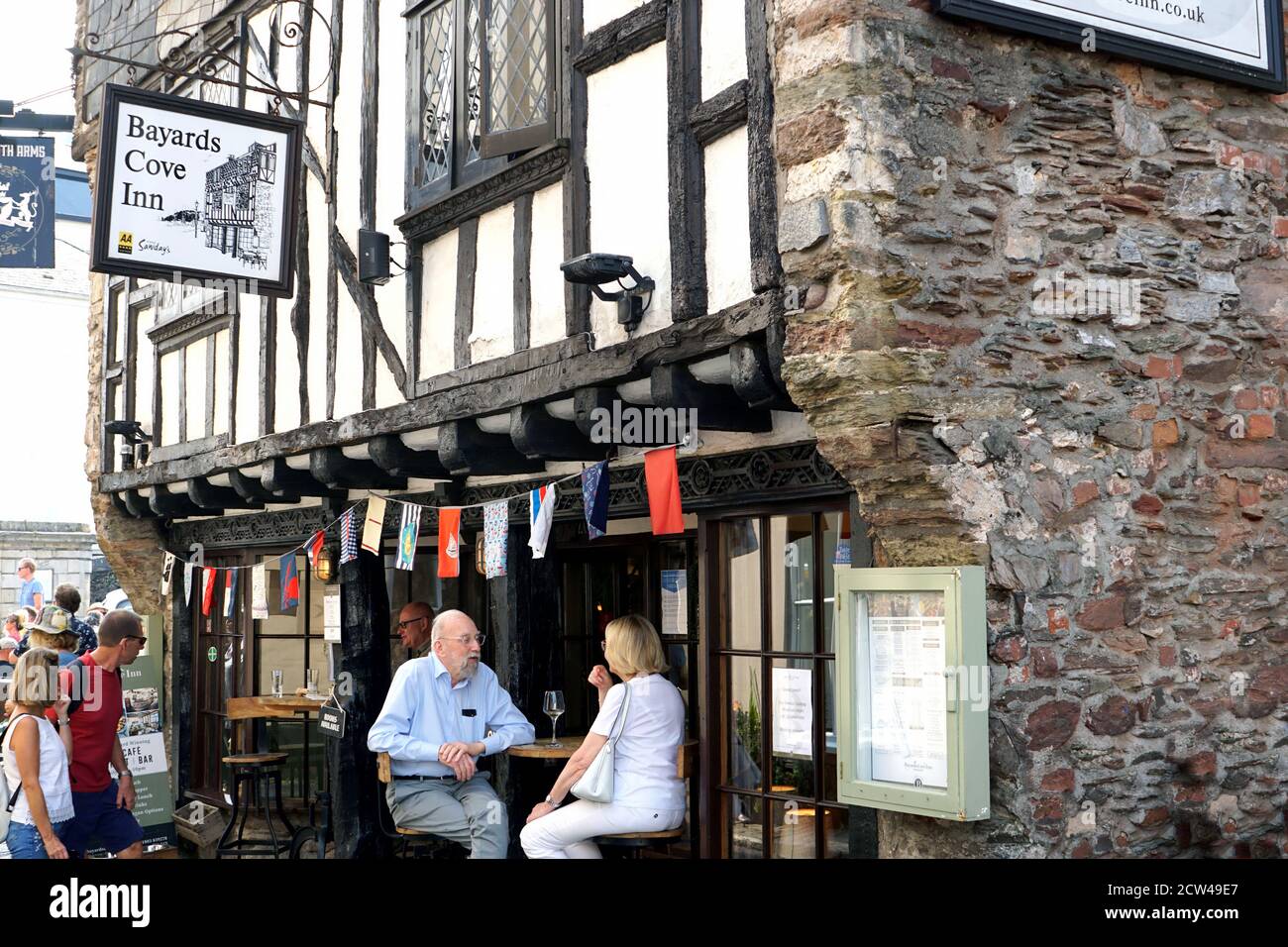 Dartmouth, Devon, UK. September 16, 2020. Tourist enjoying food and drink at one of the oldest buildings in Dartmouth, Bayards Cove is a 14th-century Stock Photo