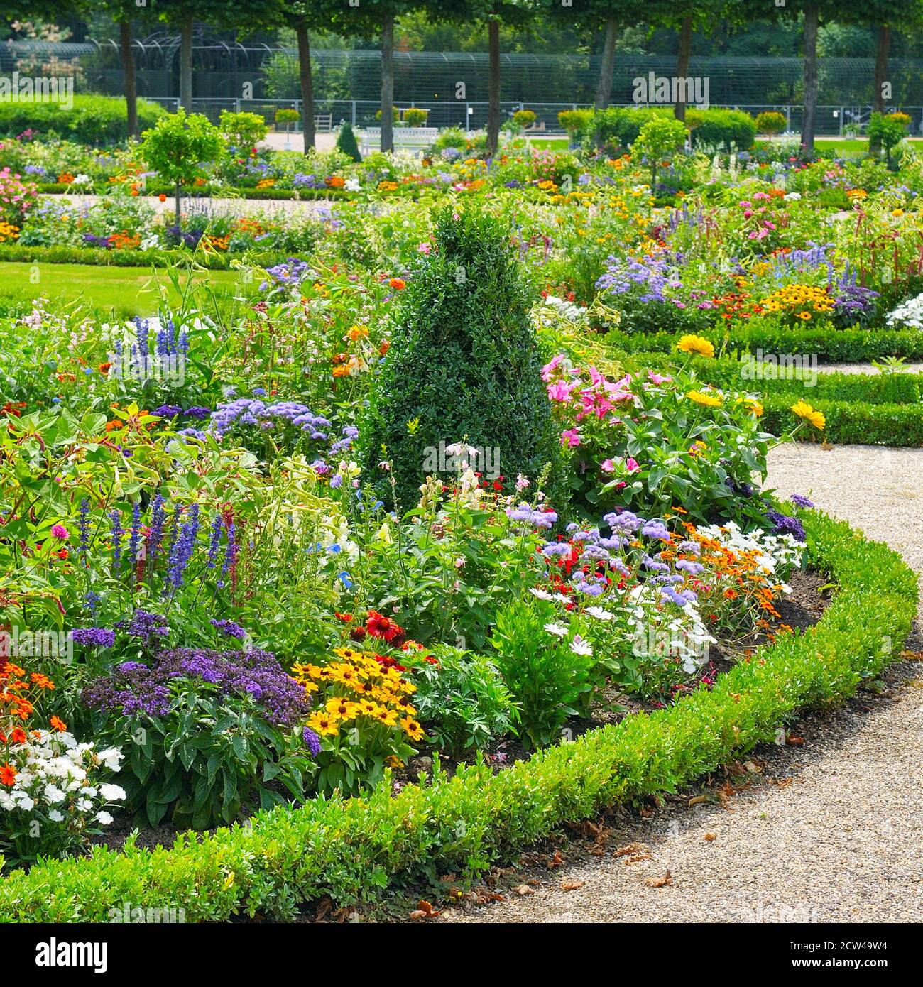 Lush flower beds in the summer garden. A bright sunny day Stock Photo ...