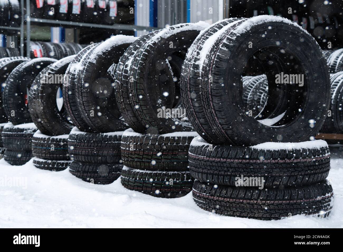 Tire and wheels shop on the street. Seasonal tire change. Stock Photo