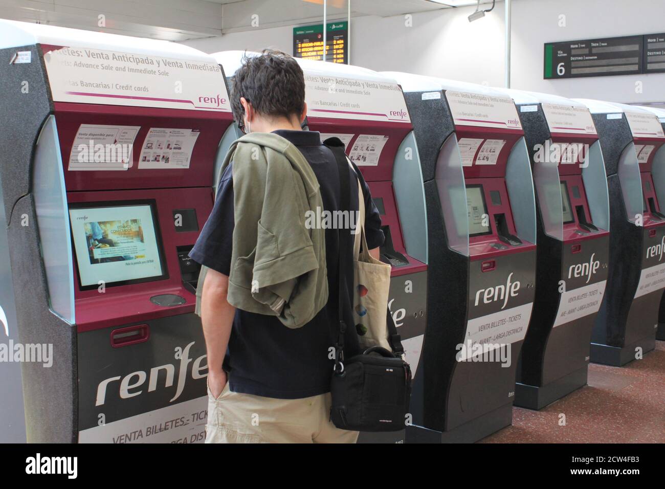 A passenger takes out a train ticket at the Chamartín station, in Madrid (Spain) in September 2020. /ANA BORNAY Stock Photo