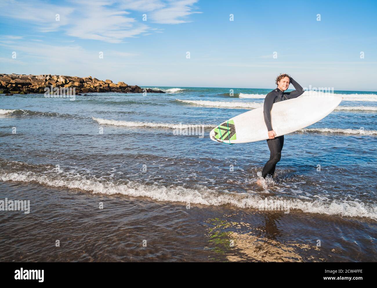 Surfer with black suit hi-res stock photography and images - Alamy