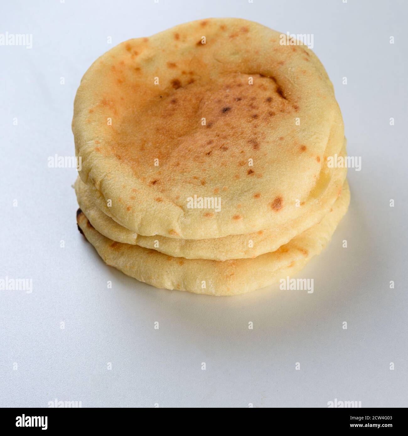 Pita bread on wooden board.Pita used in Arabic and Jewish cuisine for