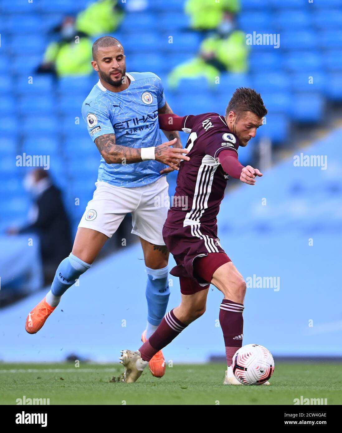 Manchester City's Kyle Walker (left) fouls Leicester City's Jamie Vardy to concede a penalty during the Premier League match at the Etihad Stadium, Manchester. Stock Photo
