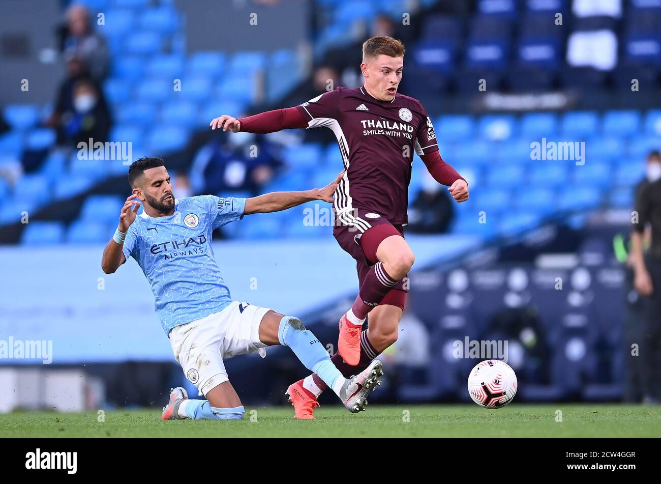 Manchester City's Riyad Mahrez (left) and Leicester City's Harvey Barnes battle for the ball during the Premier League match at the Etihad Stadium, Manchester. Stock Photo