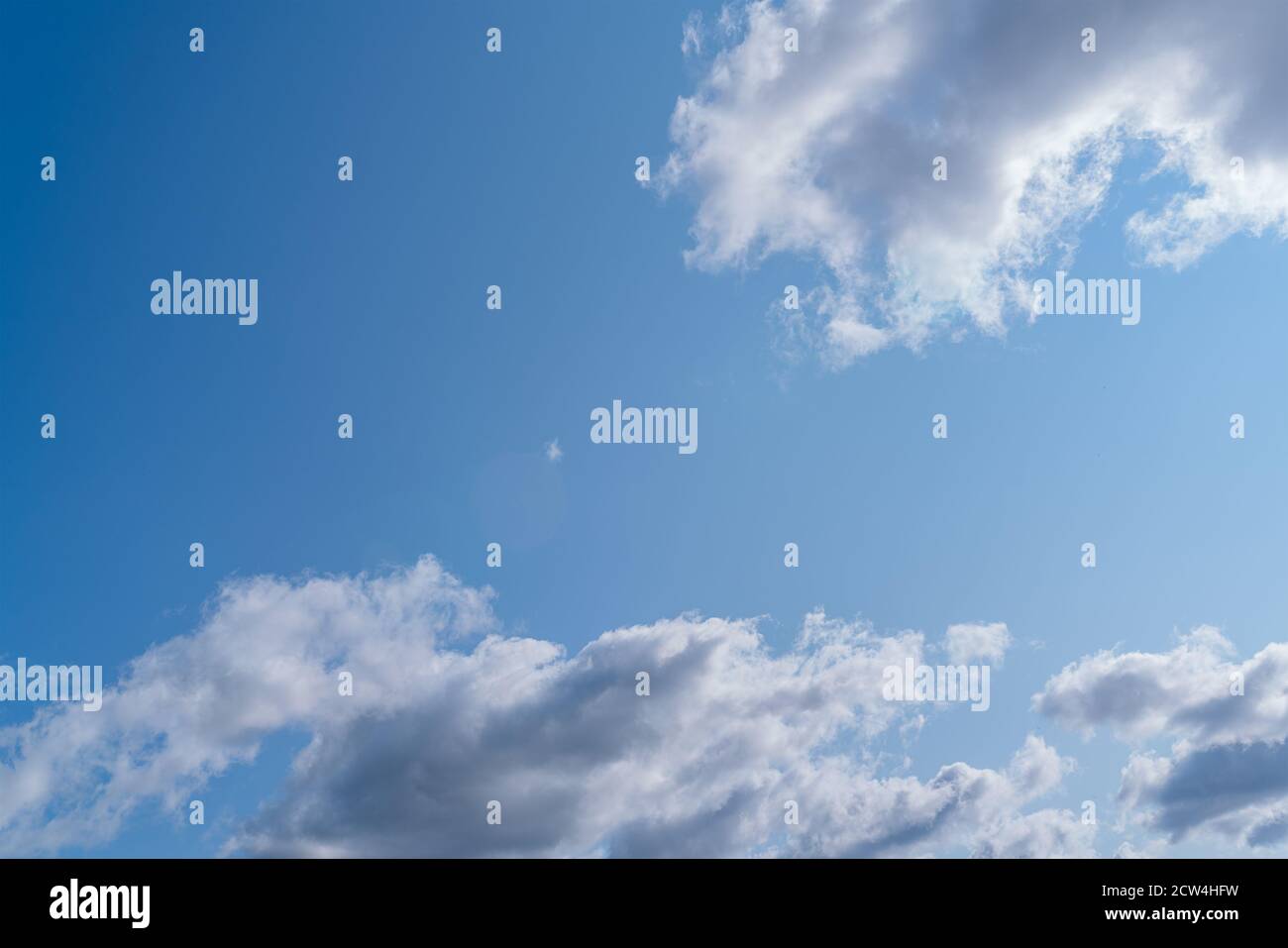 Beautiful white clouds on the clear blue sky Stock Photo
