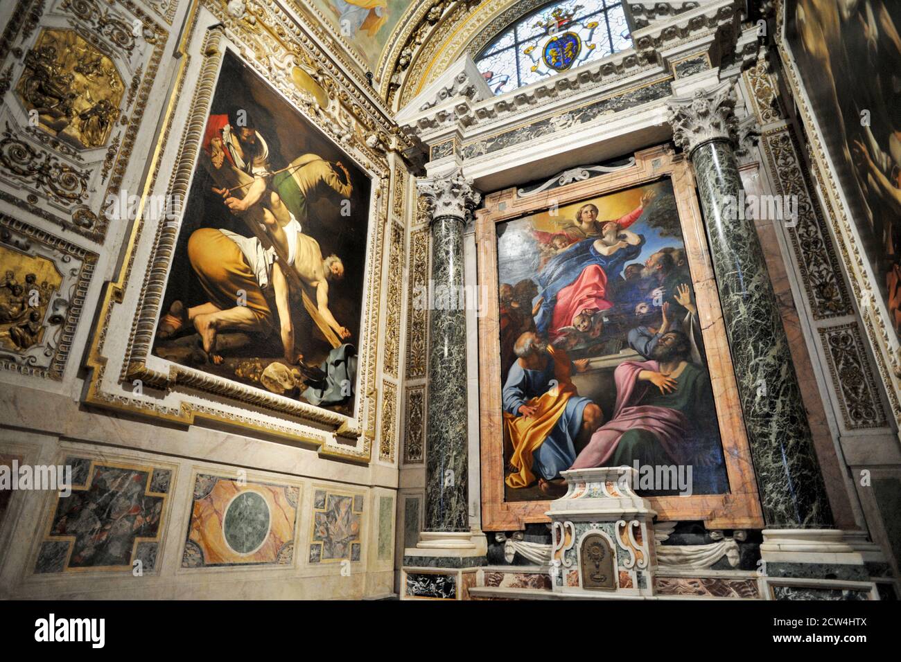 Italy, Rome, church of Santa Maria del Popolo, Cappella Cerasi, Caravaggio “Crocifissione di Pietro”, Annibale Carracci “Assunzione della Vergine” Stock Photo
